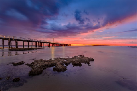 A pier at sunset