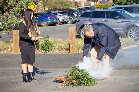 Cr Ross Ebbels partaking in a Smoking Ceremony with Wadawurrung woman Corrina Eccles for NAIDOC Week