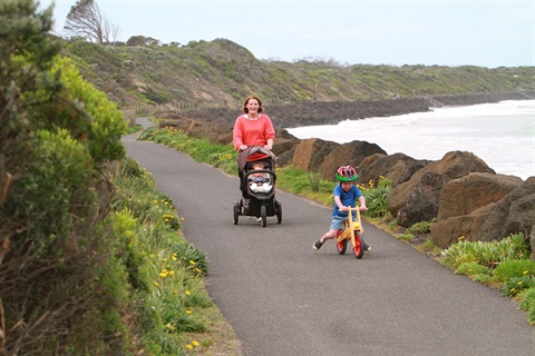 A mother and her children walk along the Point Lonsdale Promenade