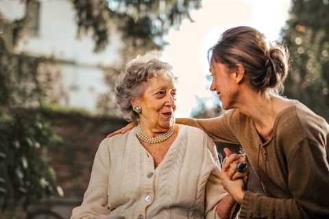 Two women talking with each other