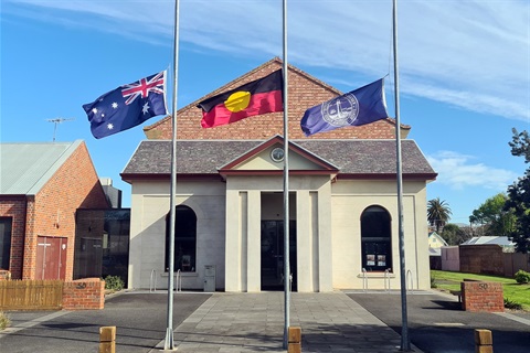 Flags at half-mast out the front of Council offices in honouring the passing of Her Majesty The Queen